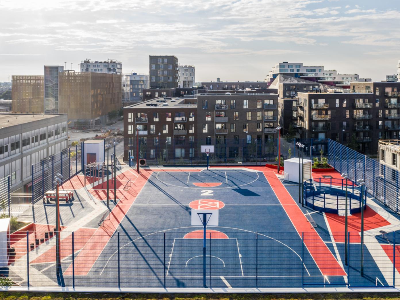 Basketball court and activity equipment on the roof of a building in the Copenhagen neighbourhood Ørestad in West Amager
